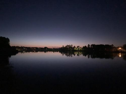 a view of a large lake at night at Bridge Inn Tomhawk - 2nd Floor, 1 King Size Bed, Balcony, River View in Tomahawk