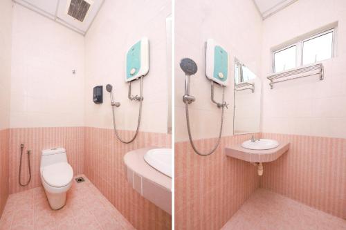 a bathroom with a shower and a toilet and a sink at Nexus Hotel in Melaka