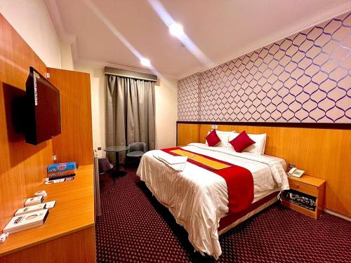 Ένα ή περισσότερα κρεβάτια σε δωμάτιο στο فندق رفاق مكة