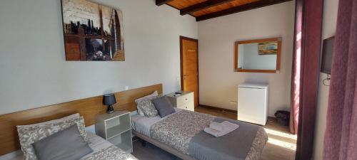 a small bedroom with a bed and a couch at Lagos Downtown Guesthouse in Lagos