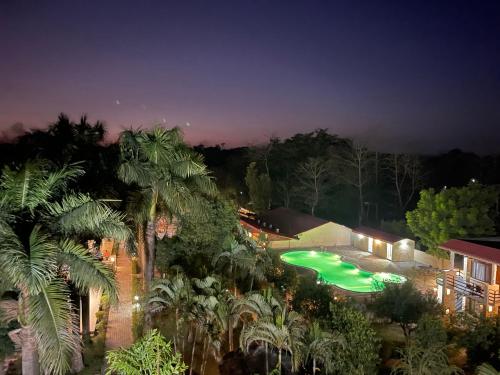 an aerial view of a house with a swimming pool at Royal Tiger Luxury Resort in Sauraha