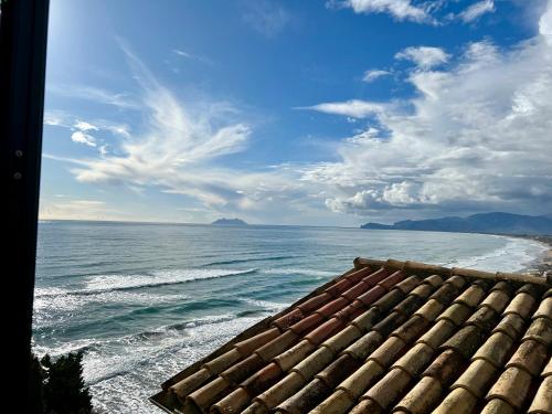 a view of the ocean from the roof of a house at Sperlonga Paradise Central Loft in Sperlonga
