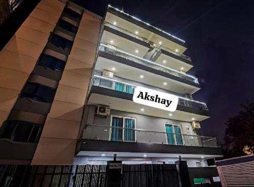 a building with an aliya sign on the side of it at Akshay dream stay in Gurgaon