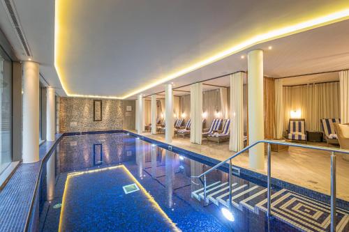 a swimming pool in a building with a hotel at Harbour Hotel & Spa Salcombe in Salcombe