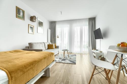 Μια τηλεόραση ή/και κέντρο ψυχαγωγίας στο Apartamenty Marina z widokiem na morze