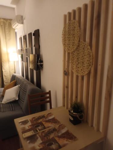 a living room with a couch and a table at STUDIO DELUXE IN MARINA CAPE 4 stars complex 33 7 in Aheloy