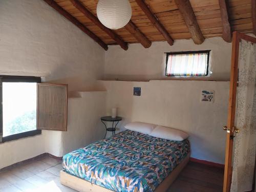 Кровать или кровати в номере El Refugio de Los Molinos