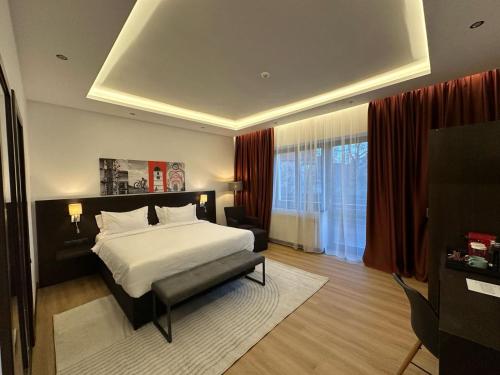 a bedroom with a bed and a television in it at Republique in Sibiu