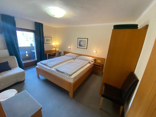 Ein Bett oder Betten in einem Zimmer der Unterkunft Pension Klimesch