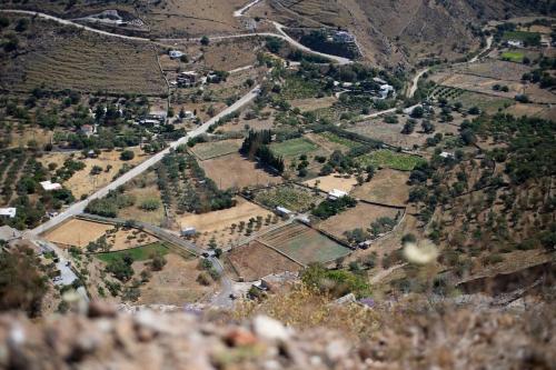 an aerial view of a village on a mountain at Kea 360 VILLAS- Dionysos Den in Korissia