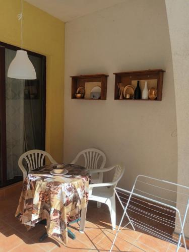 a dining room with a table and two chairs and a table and chairsktop at STUDIO DELUXE IN MARINA CAPE 4 stars complex 33 7 in Aheloy