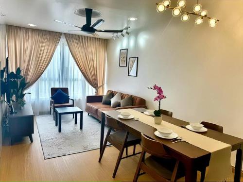 a living room with a table and a couch at GAIA RESIDENCE Gamuda Garden Rawang Skyline Luge in Rawang