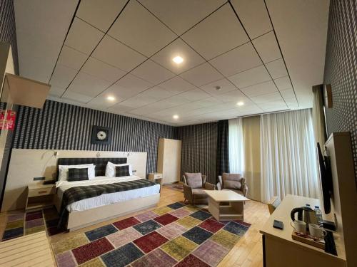 Postel nebo postele na pokoji v ubytování Badam d'Art Boutique Hotel