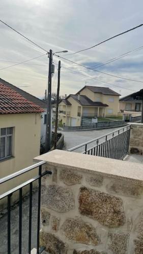 a view of a street from a balcony at Covo Residence - Casa Manhusca in Vila Cova-à-Coelheira