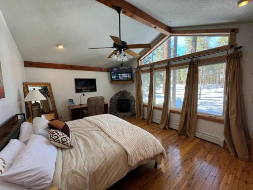 a bedroom with a bed and a large window at Sundown Lodge in Stateline