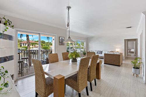 a dining room and living room with a table and chairs at Relaxing Beach Apt in las Olas Blvd in Fort Lauderdale