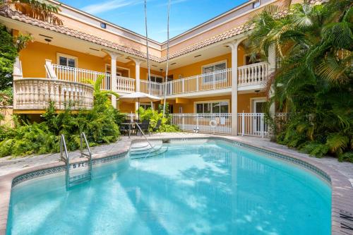a swimming pool in front of a building with a resort at Relaxing Beach Apt in las Olas Blvd in Fort Lauderdale