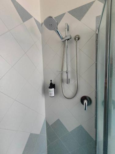 a bathroom with a shower with a shower head at B&B Casa Alessio in Santa Domenica