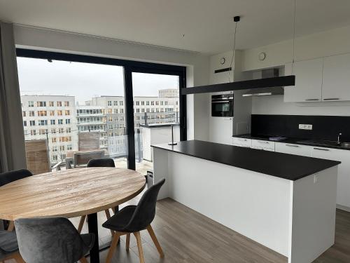 Pitsou Kedem combines four apartments to create penthouse - Dezeen - Solution-Textured-Bullet-Point-View-Penthouse-Apartment