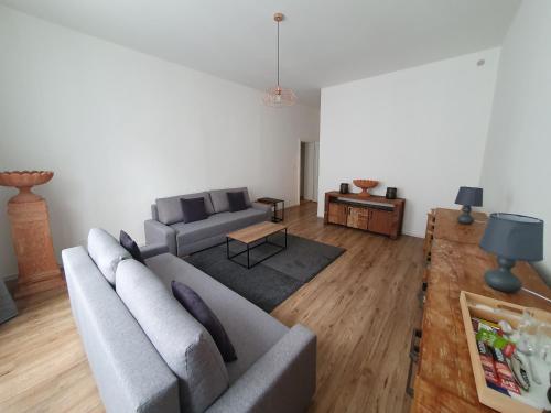 a living room with a couch and a table at WE STAY APARTMENTS in Bratislava