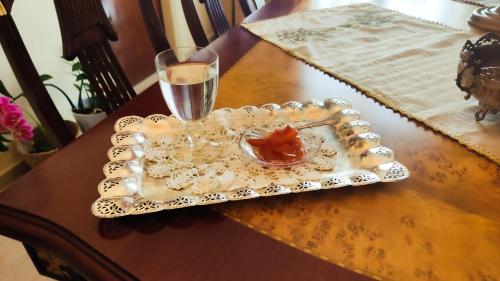 a tray with a glass of water on a table at Casa Domenica in Zakynthos Town