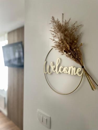 a mirror on a wall with the word welcome at Trevi u Liku in Gospić