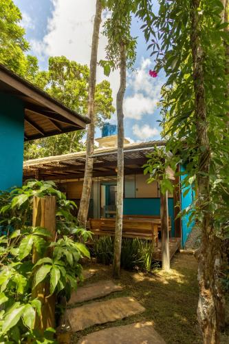 a house in the middle of a forest with trees at Vila Marina in Arraial d'Ajuda