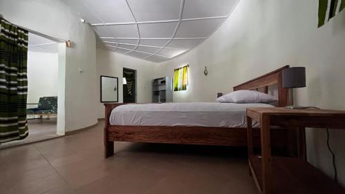 a bedroom with a large bed in a room at Campement Jamarek in Kafountine