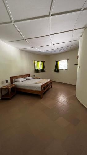a large room with a large bed in it at Lodge Jamarek in Kafountine