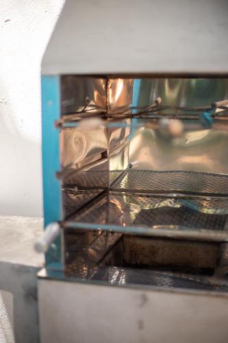 a microwave oven with some food inside of it at Vila Marina in Arraial d'Ajuda