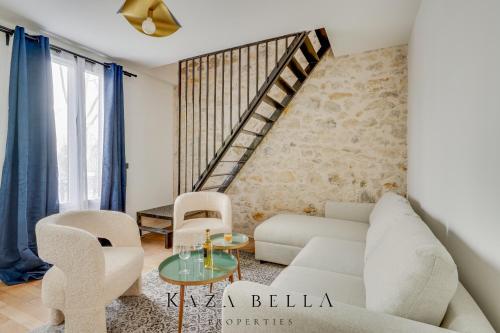 a living room with a white couch and chairs at KAZA BELLA - Maisons Alfort 7 - Large modern family flat in Maisons-Alfort