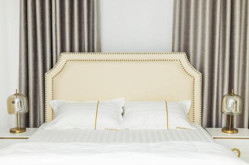 Ліжко або ліжка в номері BWAGAmoyo by Enamour