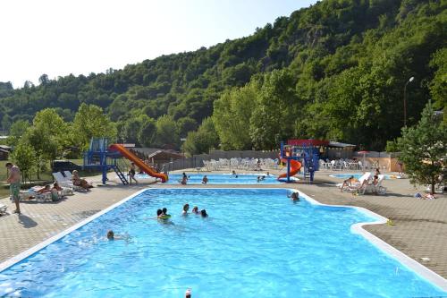 a group of people playing in a swimming pool at Panelovka in Bítov