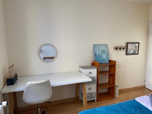 a bedroom with a desk and a bed and a mirror at Chambre Angers gare-centre ville 2 in Angers