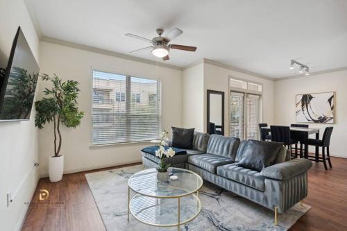 a living room with a couch and a table at Houston Med Center Luxury King Suite with Free Parking in Houston