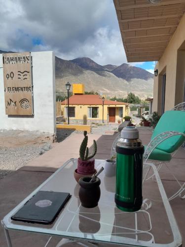 a table with a cactus on top of a patio at 4 ELEMENTOS in Huacalera
