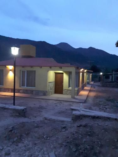 a house with a street light in front of it at 4 ELEMENTOS in Huacalera