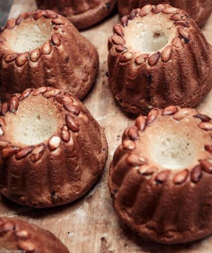 a group of chocolate donuts sitting on a table at Studio lumineux, à 2 minutes de Colmar in Horbourg