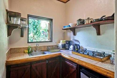 a kitchen with a sink and a counter top at Casas Mal Pais in Mal País