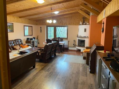 a living room with a couch and a dining room at Residenz Pal in Kokava na Rimavica