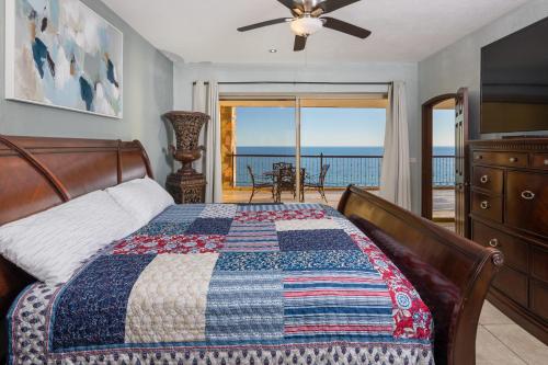 a bedroom with a bed and a view of the ocean at Sonoran SKY #910 in Puerto Peñasco