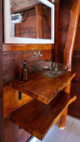 a wooden counter with a sink in a bathroom at Kite Eco House Salinas del rey in Salina de Rey