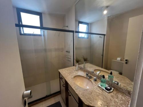 a bathroom with a sink and a shower at MC FLATS THE CLARIDGE in Rio de Janeiro