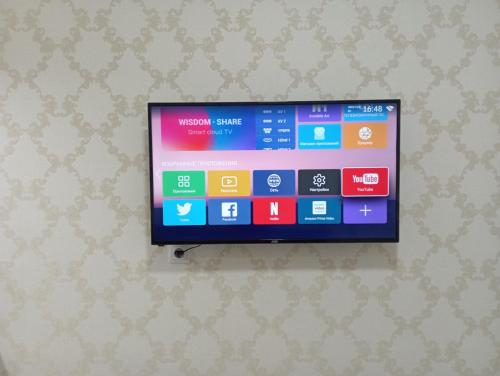 a flat screen tv hanging on a wall at ЖК Арай in Aktobe
