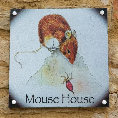 a picture of a mouse house on a sign at Mouse House at Tove Valley Cottages in Towcester