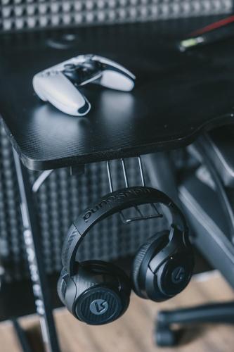 a pair of headphones sitting on top of a table at House with a cinema and games room, sleeps 17 in Shrewsbury