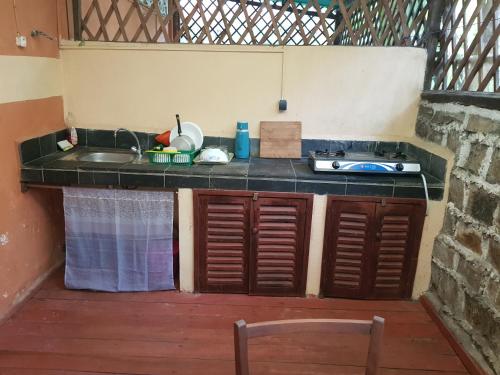 a kitchen with a sink and a counter top at Spices Beach Studio Madirokely Nosy Be in Nosy Be