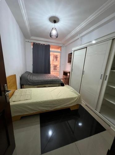 Ein Bett oder Betten in einem Zimmer der Unterkunft Apparemment paisible