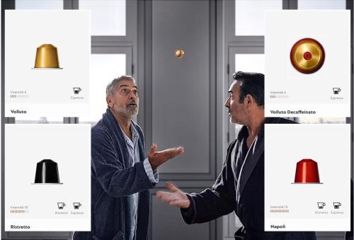 two men are standing in front of a wall withartifacts at Mas CamPau in Fontvieille