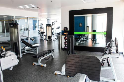 a gym with several treadmills and machines in it at Hampton Inn & Suites by Hilton Aguascalientes Aeropuerto in Aguascalientes